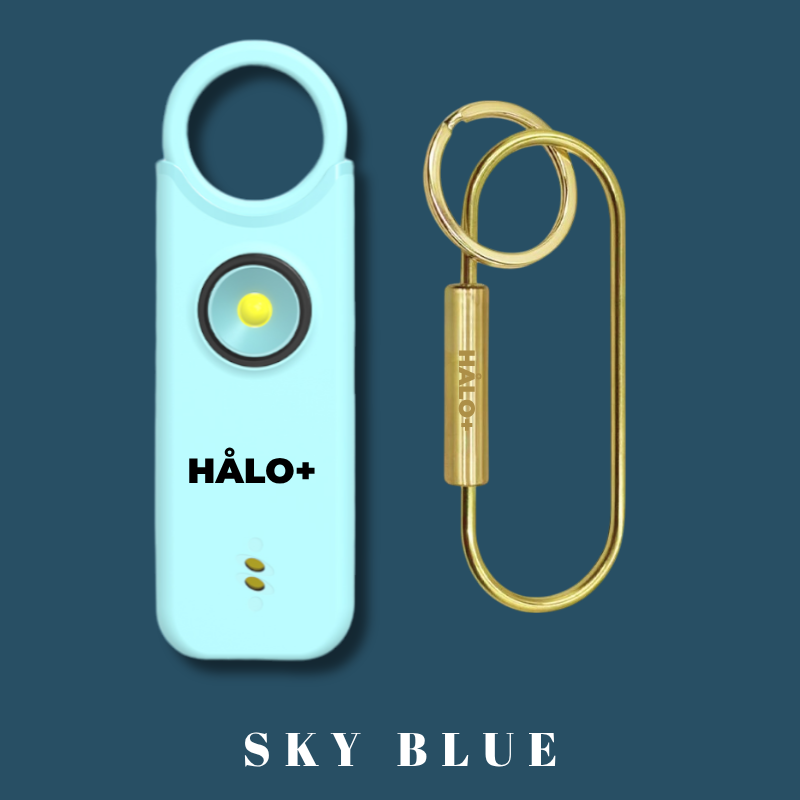 Halo+ device with a gold keychain on a dark blue background